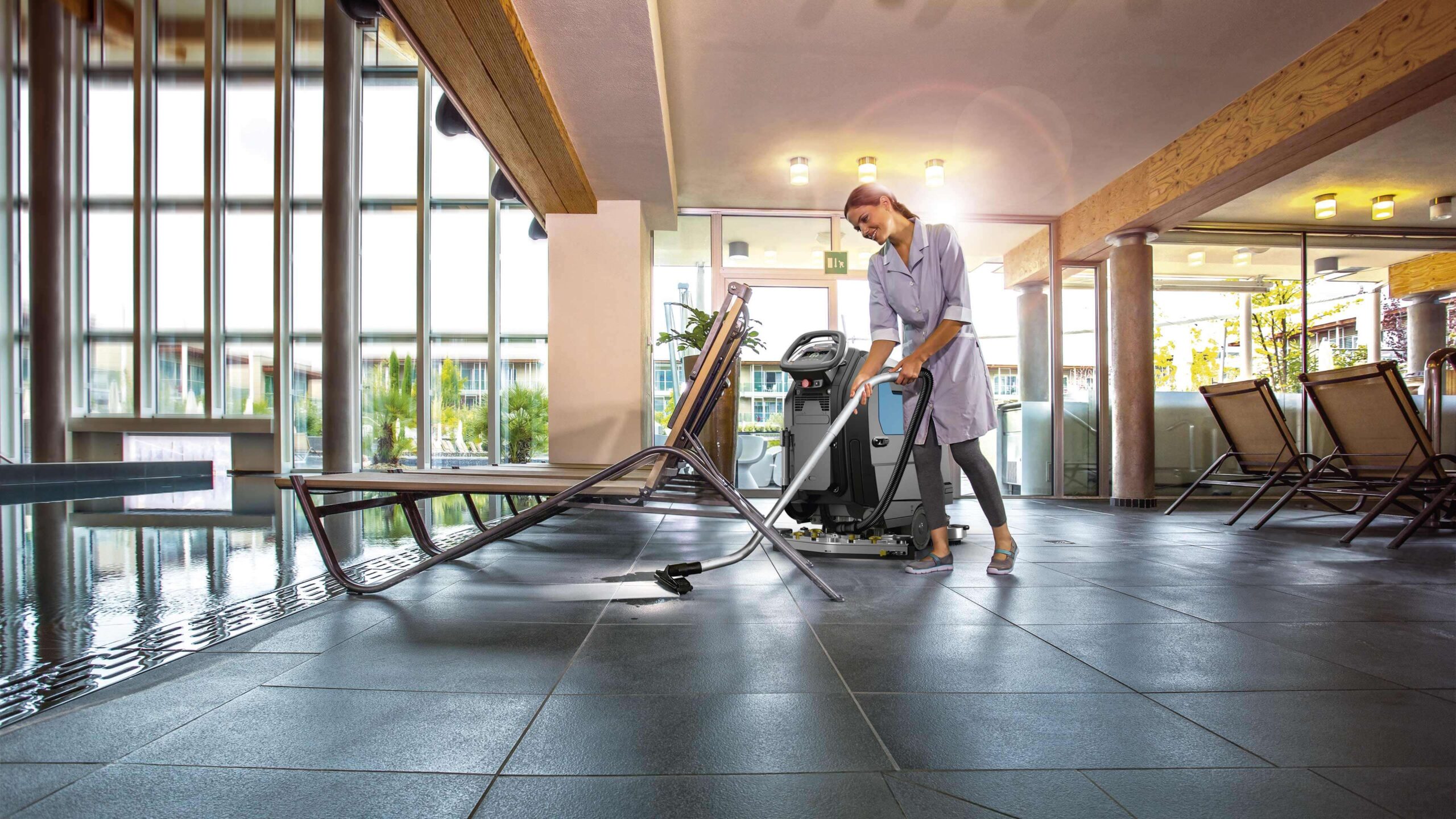 http://Worker%20Using%20Maxima%2050%20To%20Clean%20Under%20Chairs