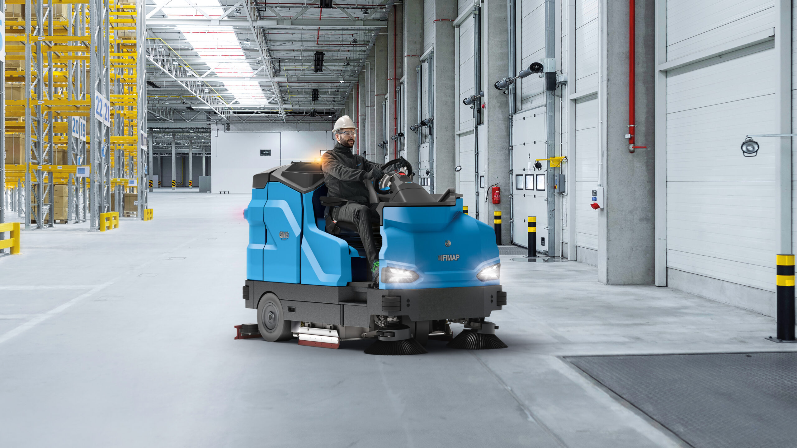 http://Man%20Using%20GMG%20Sweeping%20And%20Scrubbing%20Machine%20In%20Warehouse